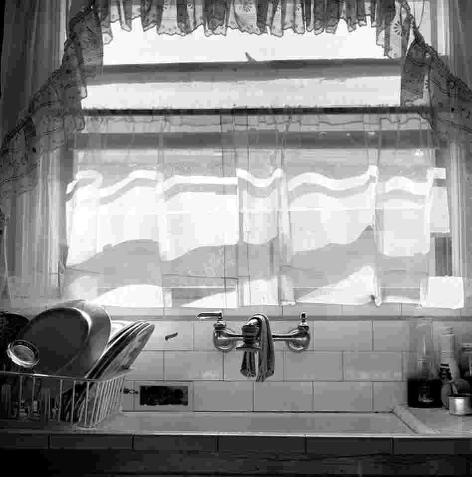 Lupe's kitchen, 1970s.  Quiet domestic scenes recur in Leonard's book.