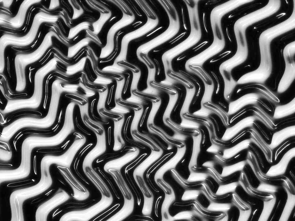 Add water to a thin layer of gel on the surface of an elastic polymer and you get a "polymaze." This image was made with an ordinary light microscope and is not manipulated or artificially colored. 