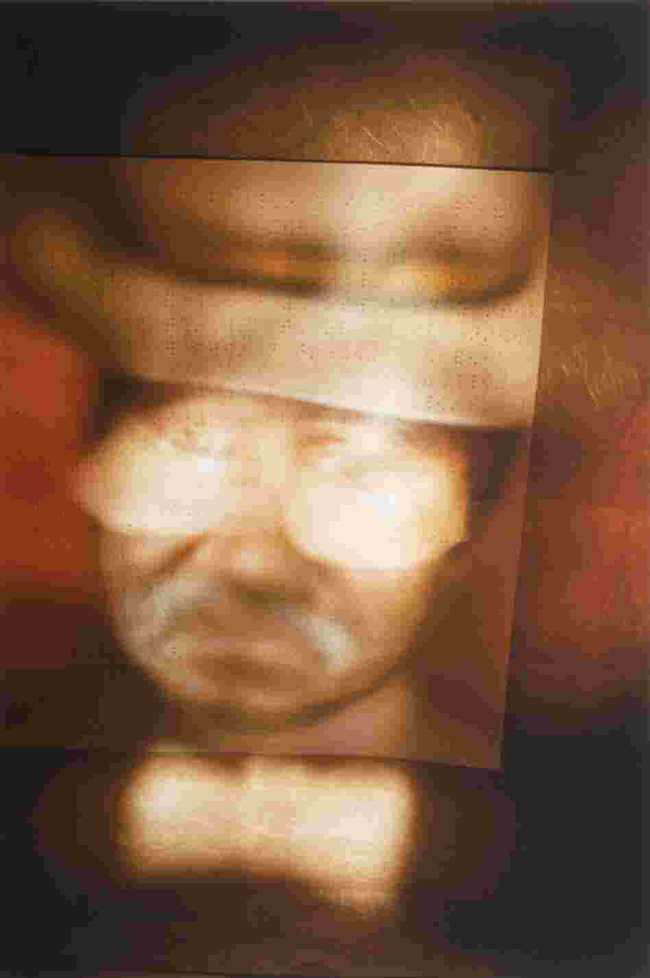 "Box Portrait, Jacques" by Seeing With Photography Collective. Sighted assistants help the photographers of this New York City-based collective compose their images. In a darkened room, with a very long exposure, the photographers use flashlights to paint light into the image.