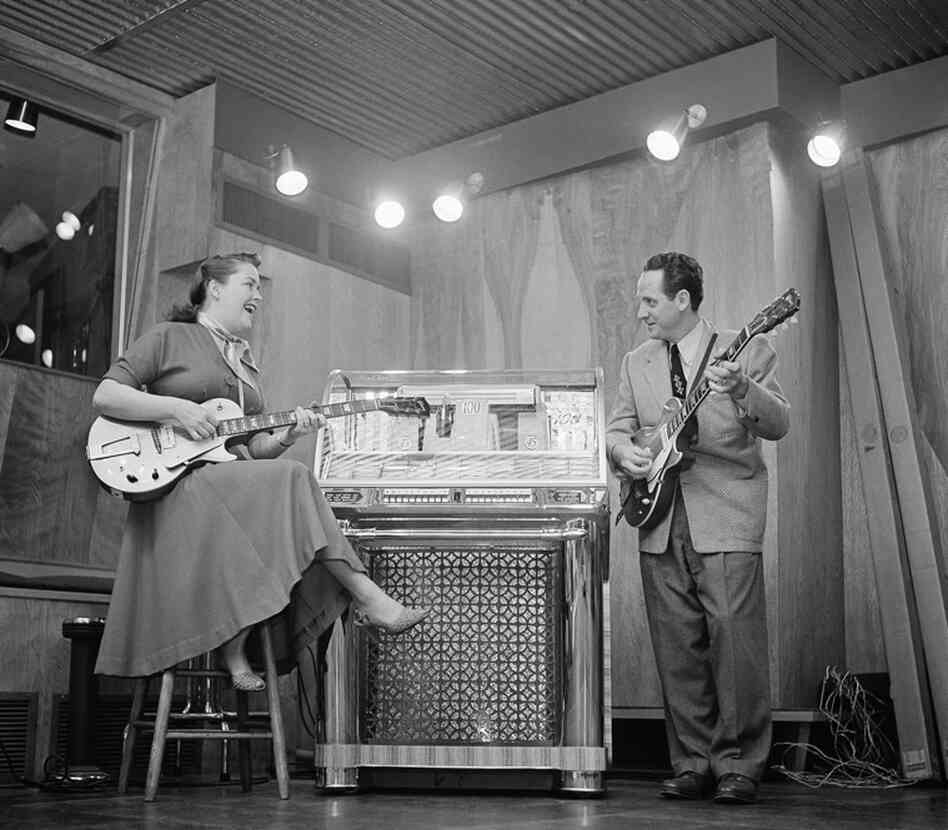 Paul and his wife, Mary Ford, practice in their Oakland, N.J., home on Dec. 20, 1953. The duo earned 36 gold records and 11 No. 1 pop hits from 1949 to 1962. 