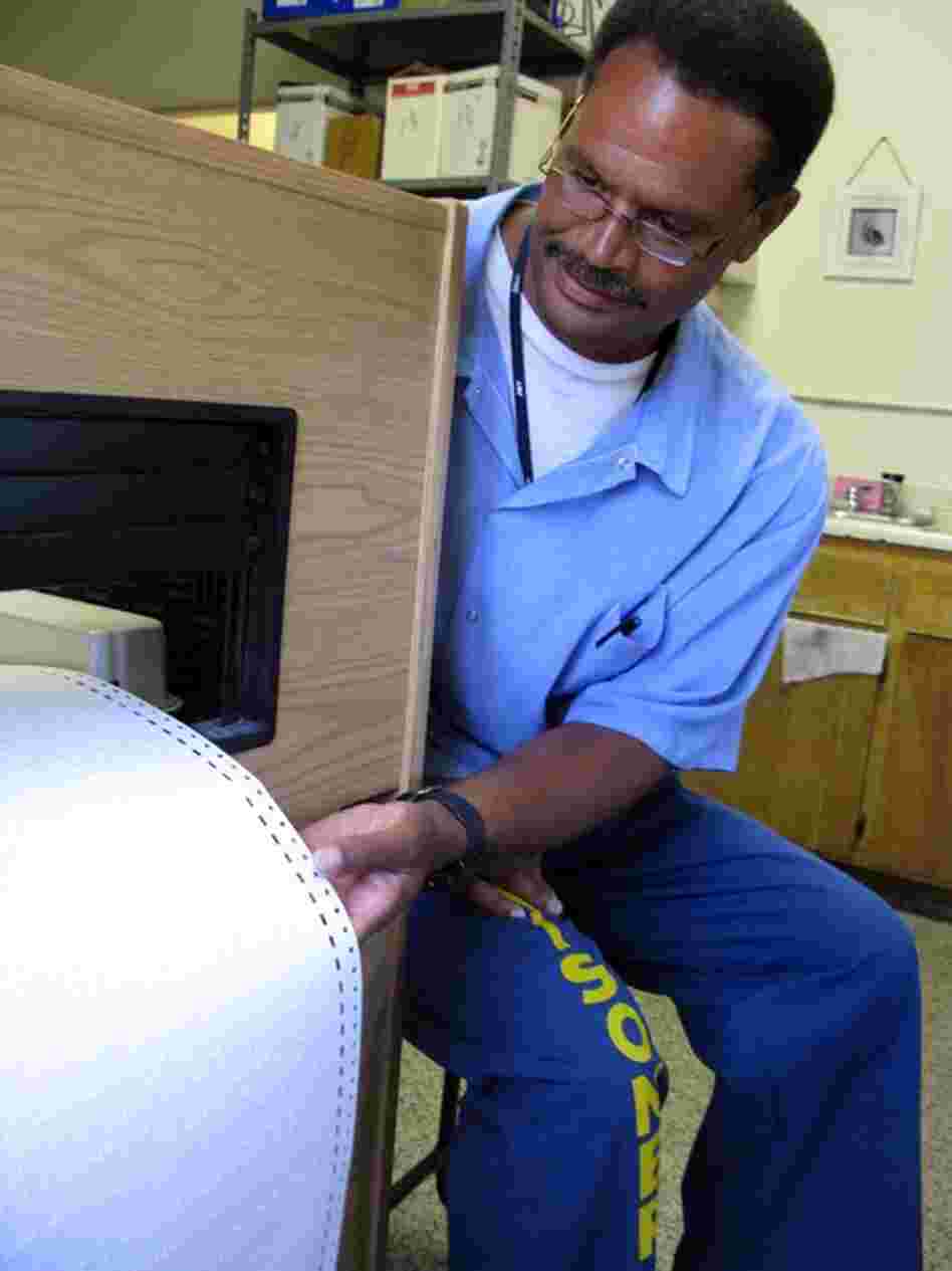 Mark Dorn prints out a Braille textbooks for the Folsom's Braille translation program. Since the program launched 20 years ago, none of its graduates have returned to prison after release. 