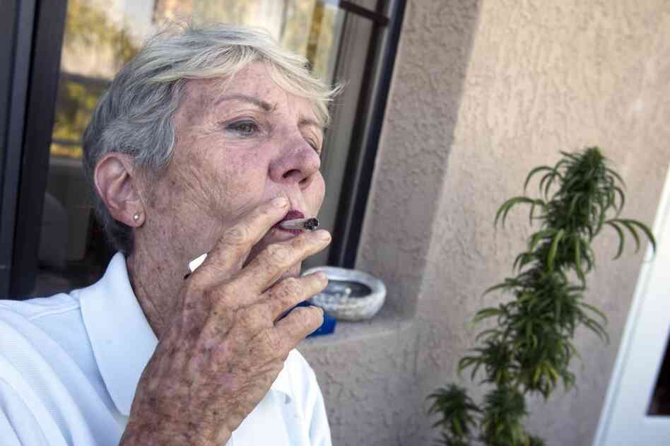 Before heading off to swim practice, Bouer smokes a joint filled with cannibis she's grown.