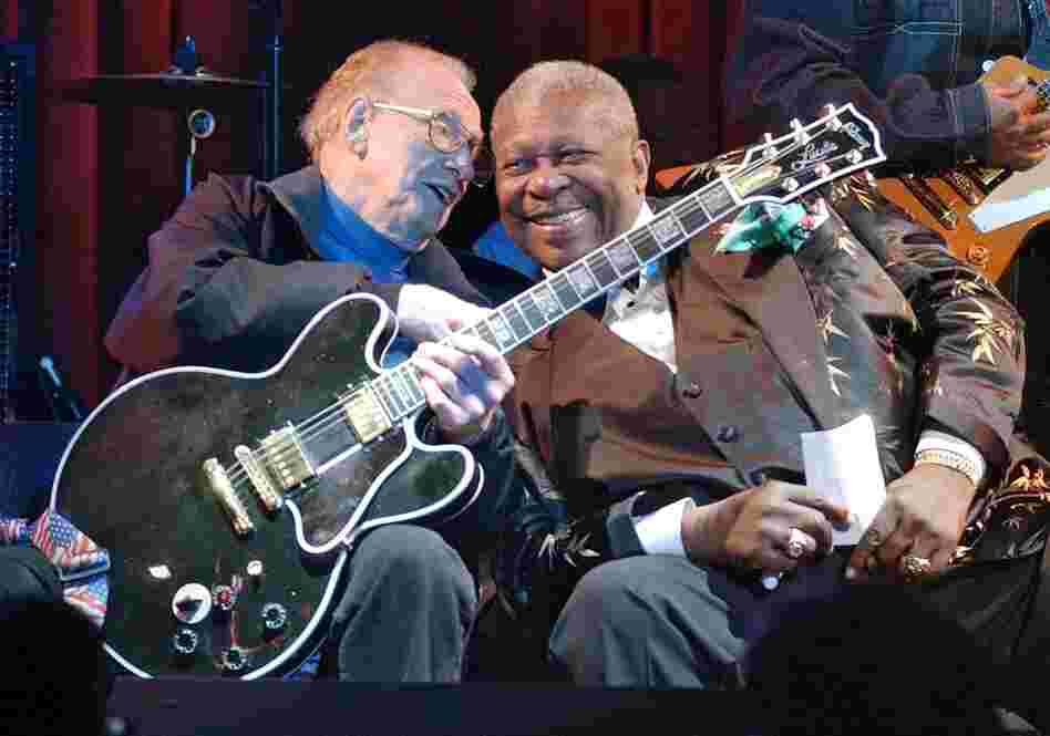 Paul and blues guitarist B.B. King put their heads together during a jam session at the third anniversary celebration of the B.B. King Blues Club and Grill in New York's Times Square, June 17, 2003. Paul holds King's signature guitar, "Lucille,"  which he played. 