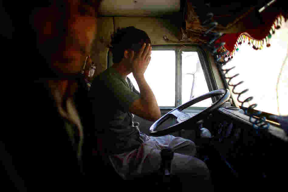 A truck driver wipes his eyes after driving all night to deliver voting materials in the Yangam district of Badakhshan province. The terrain is so treacherous and roads are so poor that it can take up to 24 hours to travel 30 miles. Yangam has become especially difficult to reach this year after winter floods.