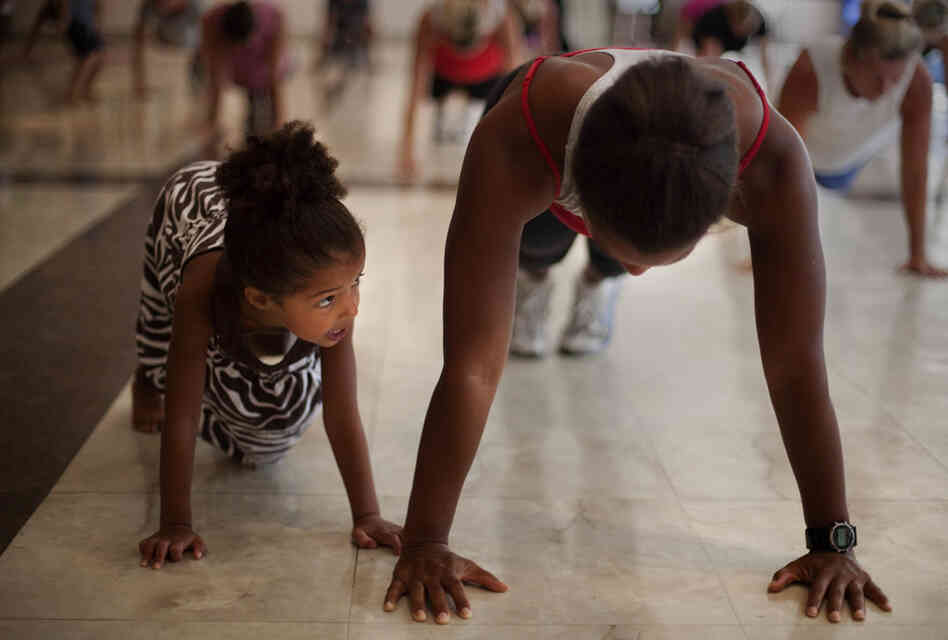 Stephanie Maurer of Silver Spring, Md., attends the workout class with her daughter Riley.