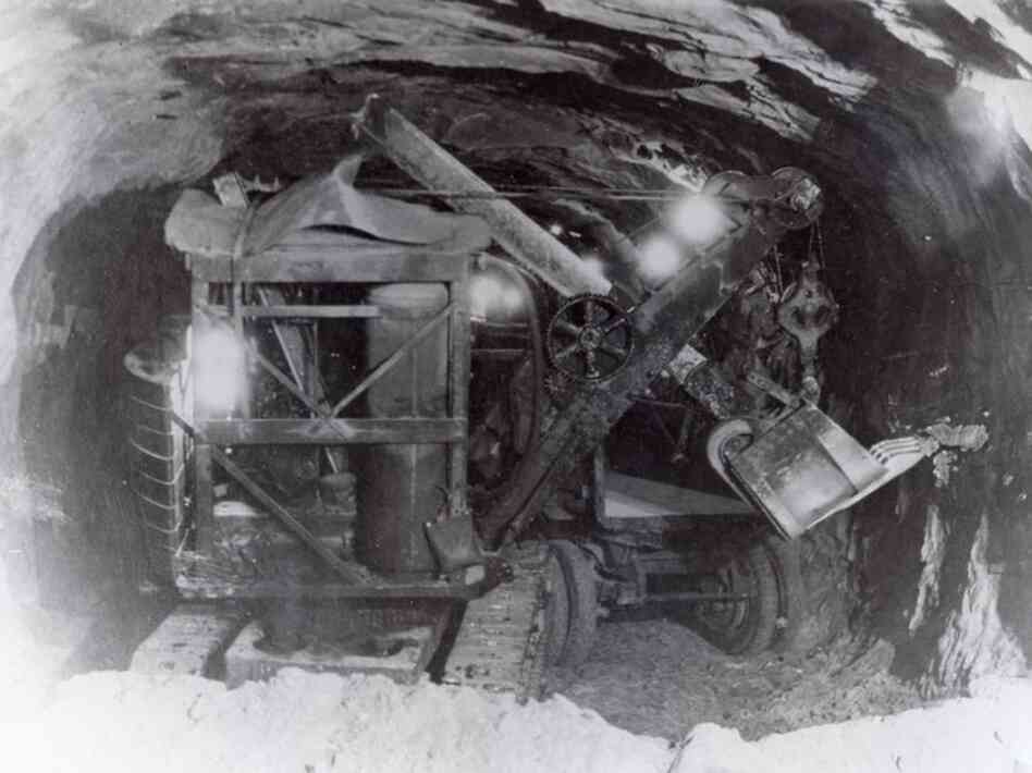 An Erie Air Shovel scrapes away rock to widen Zion Tunnel in the late 1920s.  When completed in 1930, the tunnel was the longest in the U.S. Credit: William Crawford