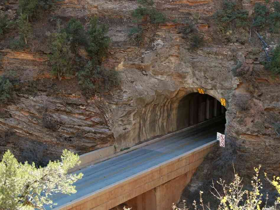 This image shows the east entrance of the Zion Tunnel in 2007. The entrance is so narrow that today's RVs require ranger escorts and the closure of the opposite lane to traffic. Credit: Nick Jorgensen