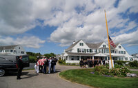 The Kennedy family watches as Sen. Kennedy's casket is loaded into the hearse on Friday.