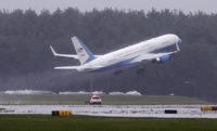 A plane carrying Kennedy's remains takes off from Hanscom Air Force base in Bedford, Mass., en route to Washington.