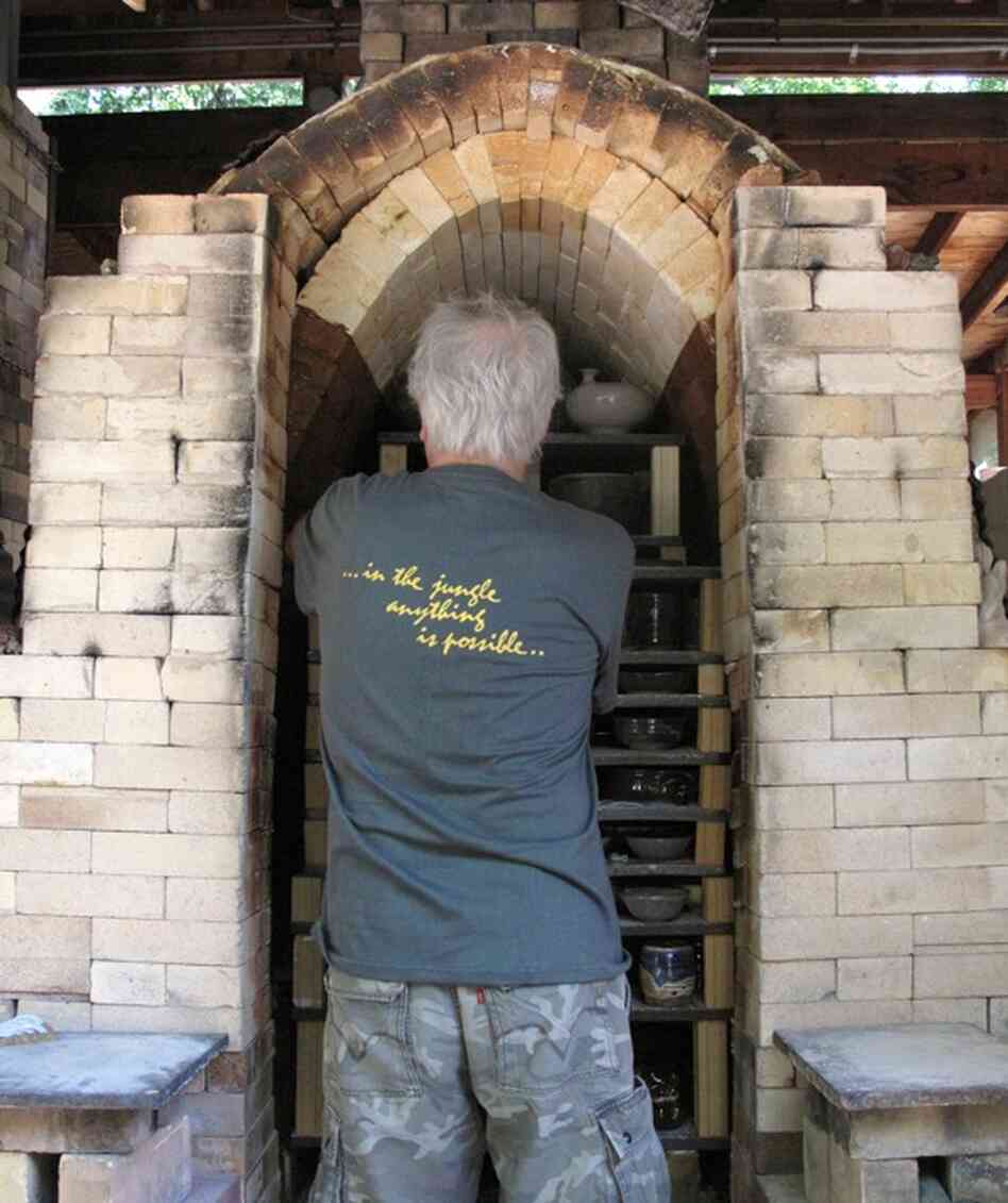 Jeff Kirk, Glen Echo's pottery guru and chief instructor, unloads the kiln.