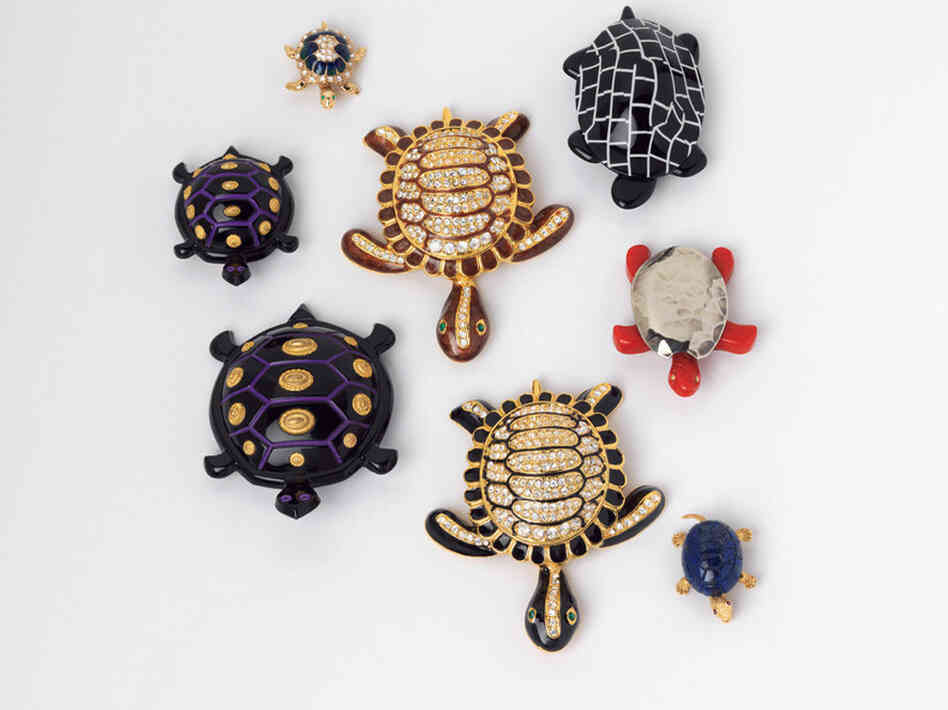 Black and White Turtle, Lea Stein (France), 1990; Small Purple, Black and Gold Turtle, Isabel Canovas (France), c. 1980; Black and Brown Rhinestone Turtles, Designer Unknown (USA), 1997; Blue Rhinestone Turtle, Designer Unknown (USA), c. 1998; Red Turtle, Designer Unknown (USA), c. 1997 - Turtle pins were used to signify the slow progress of the Middle East peace process.
