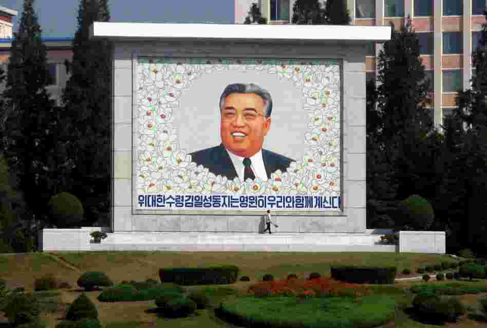 There are an estimated 140,000 monuments to Kim Il Sung in the country. Here, a street sweeper cleans a giant picture of the man North Koreans call the "Great Leader." 