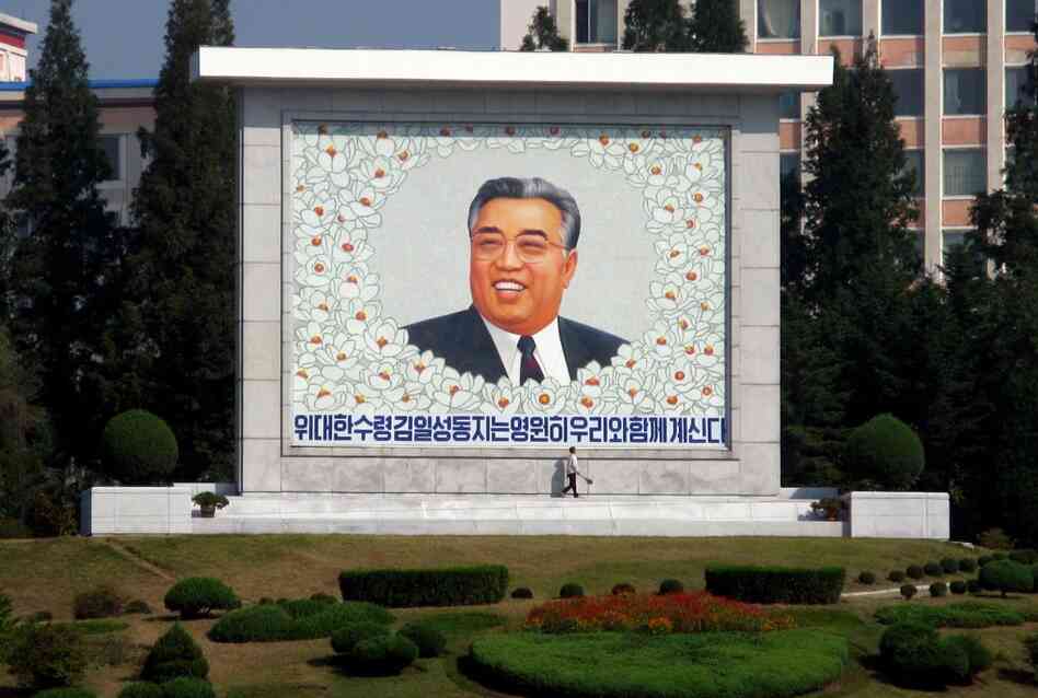 There are an estimated 140,000 monuments to Kim Il Sung in the country. Here, a street sweeper cleans a giant picture of the man North Koreans call the "Great Leader." 