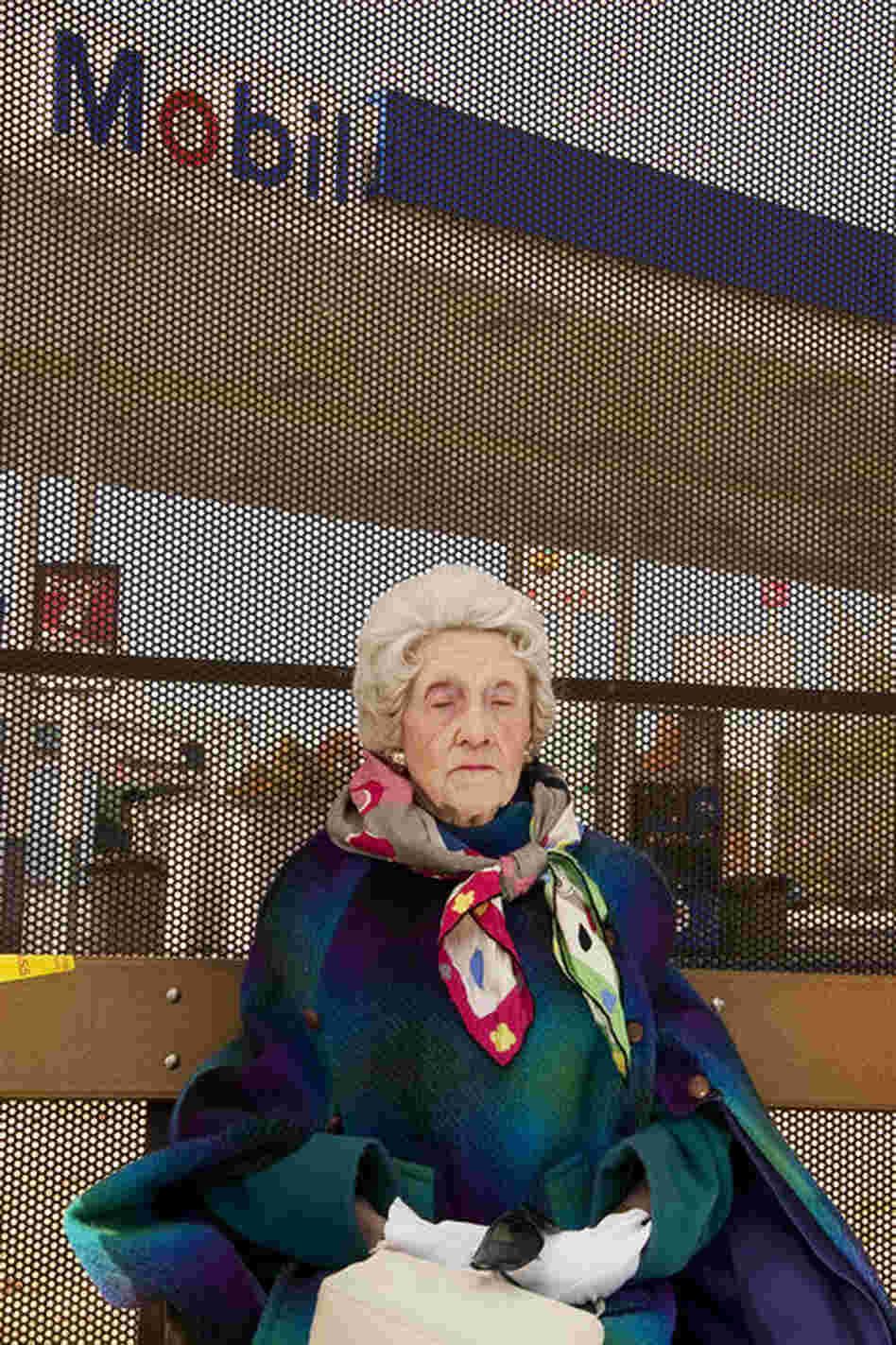 "A 97-year-old woman waits for the bus in her Sunday best in Chamblee, Ga." 