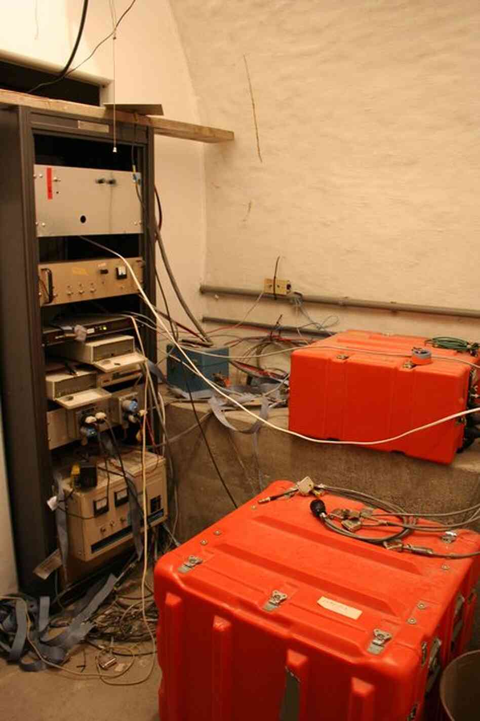Orange boxes contain computers that transmit data about seismic events. Many of the computers are 10 to 20 years old. In September, the Obama administration announced $5 million in stimulus funds to update and replace the machines. The new computers will shave five seconds off the time it takes to deliver an earthquake warning. 