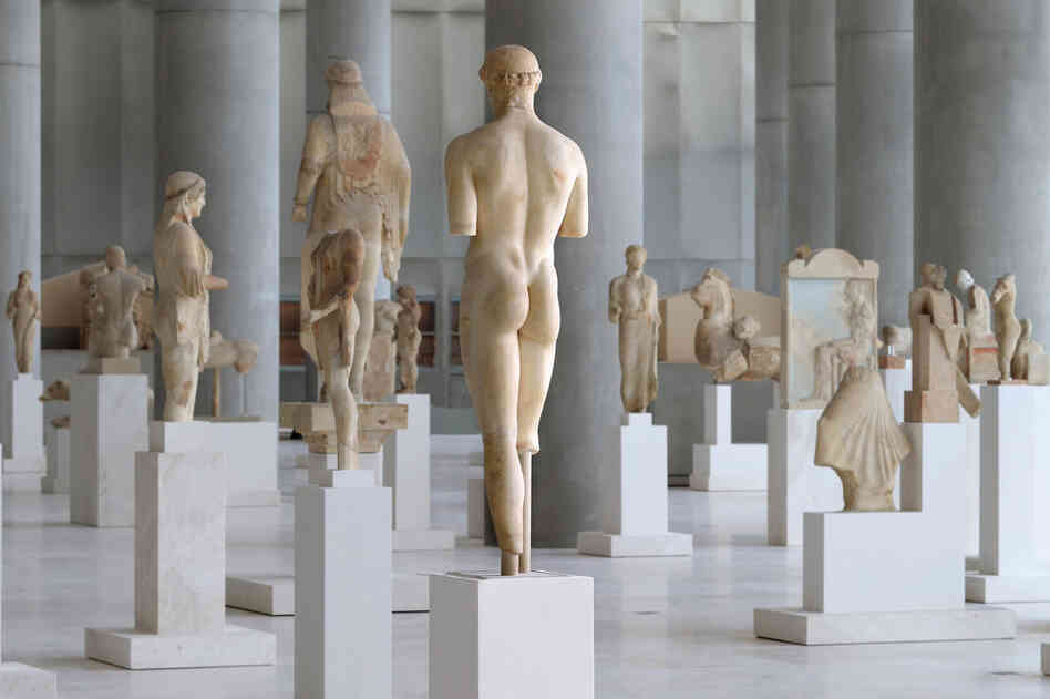A view of the Archaic Gallery in which statues are displayed in the open, allowing visitors to walk among the various artifacts. 