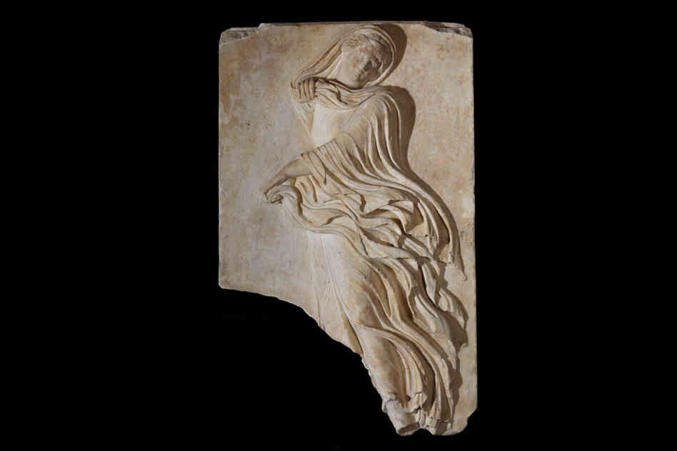 A relief plaque depicting a female dancer from the Theatre of Dionysus, circa 1st century B.C. 