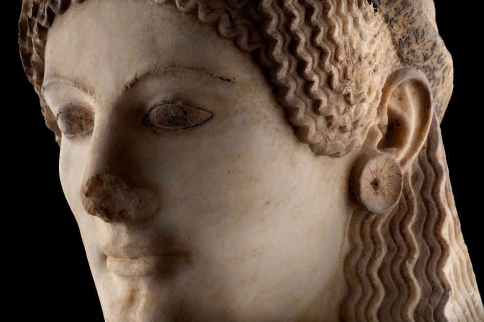 A detail of the marble sculpture known as Peplos Kore, circa 530 B.C., a statue of a young Greek woman now on display in the museum. 