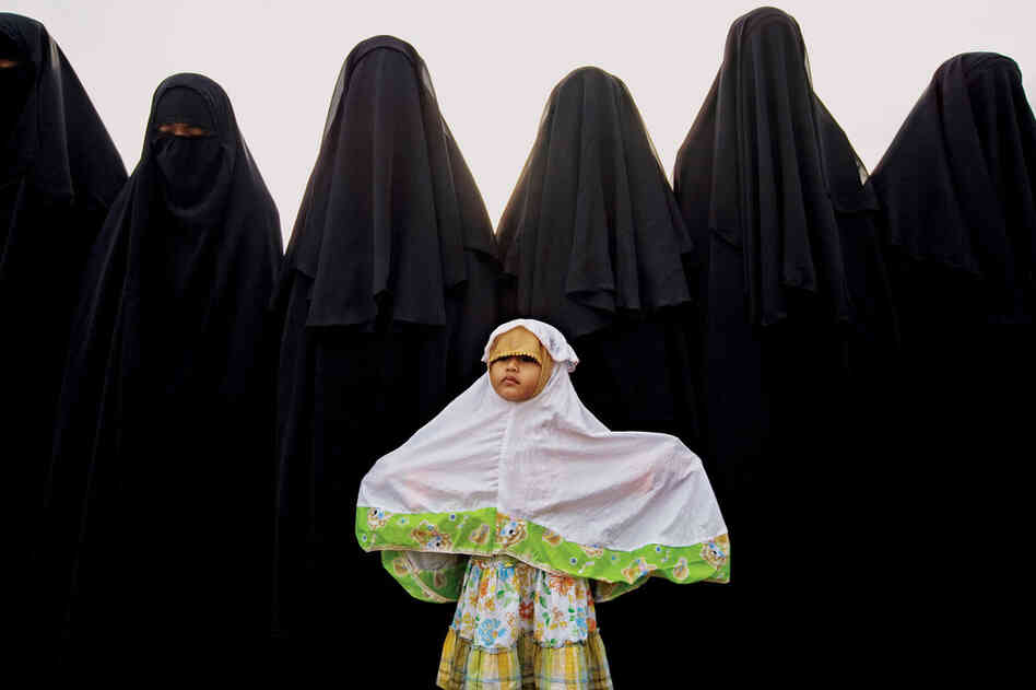 The women of the An-Nadzir commune begin Islam's Feast of the Sacrifice, celebrating the Koran's account of God sparing the prophet Ismail.