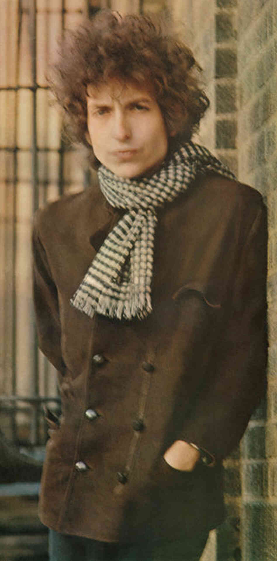 Bob Dylan, Blonde on Blonde, New York City, 1966. "We started photographing in the studio and got some very nice photographs but nothing that I thought would be a cover. ... I have always liked the Meatpacking District so we went there. It was cold and neither one of us was dressed warm enough, and because the photograph is blurred and has movement, people were trying to analyze it as some s...