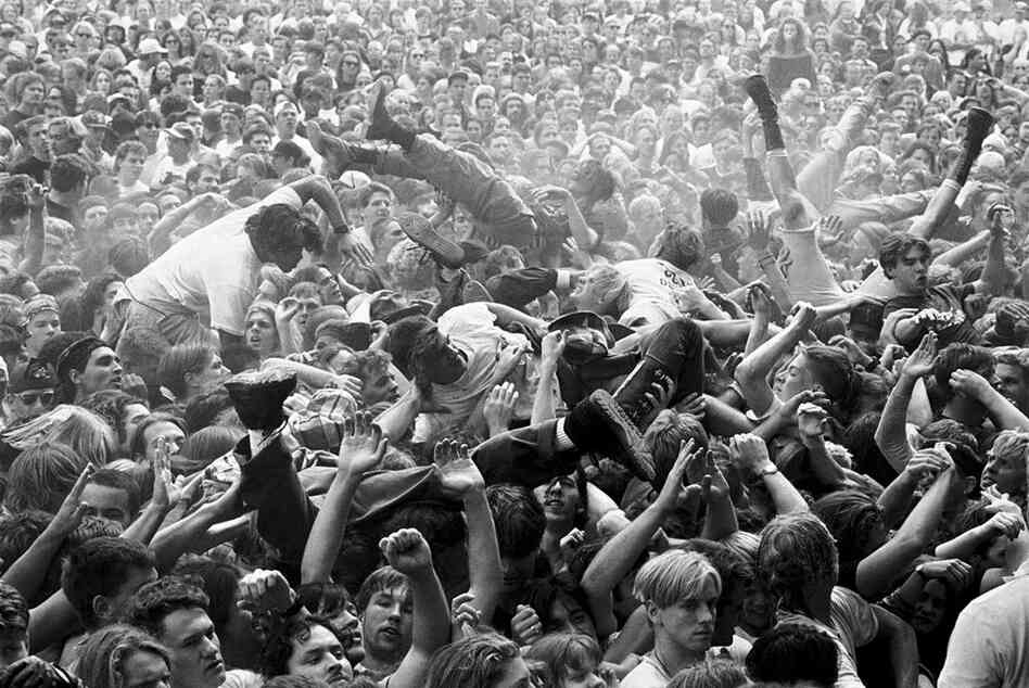 Mosh pit at a Mudhoney concert at Endfest, Kitsap County, Washington, 1991. "I've probably changed more than the rock scene has! I don't make it out much anymore being 45 and with a new baby. I do think that the photography has changed, and not for the better. Less access, more controlled by labels and publicists, too much emphasis on the staged portrait. I find it all pretty boring." (C...