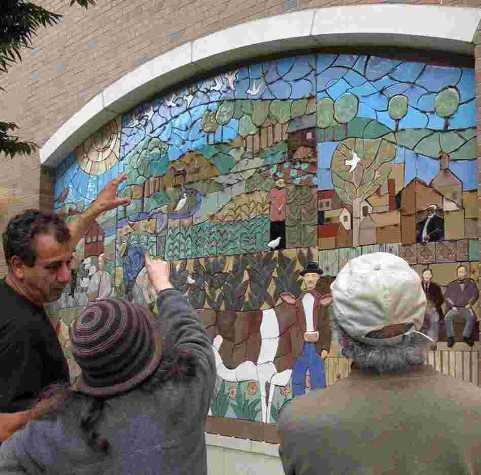 Three large archways will be filled with vibrant, handmade tiles.  Judith hand crafts each tile, Tulio helps with the design and cutting. An outside contractor finishes the grouting work.