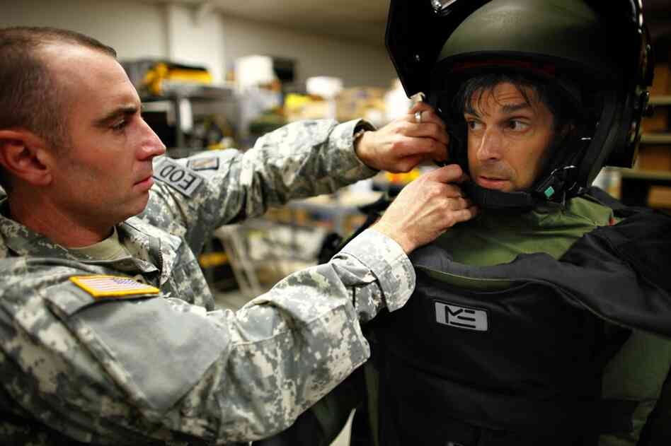 The helmet alone weighs 12 pounds. If you lose your balance, Auster is told, it's better to let yourself fall. The weight could snap your wrists.