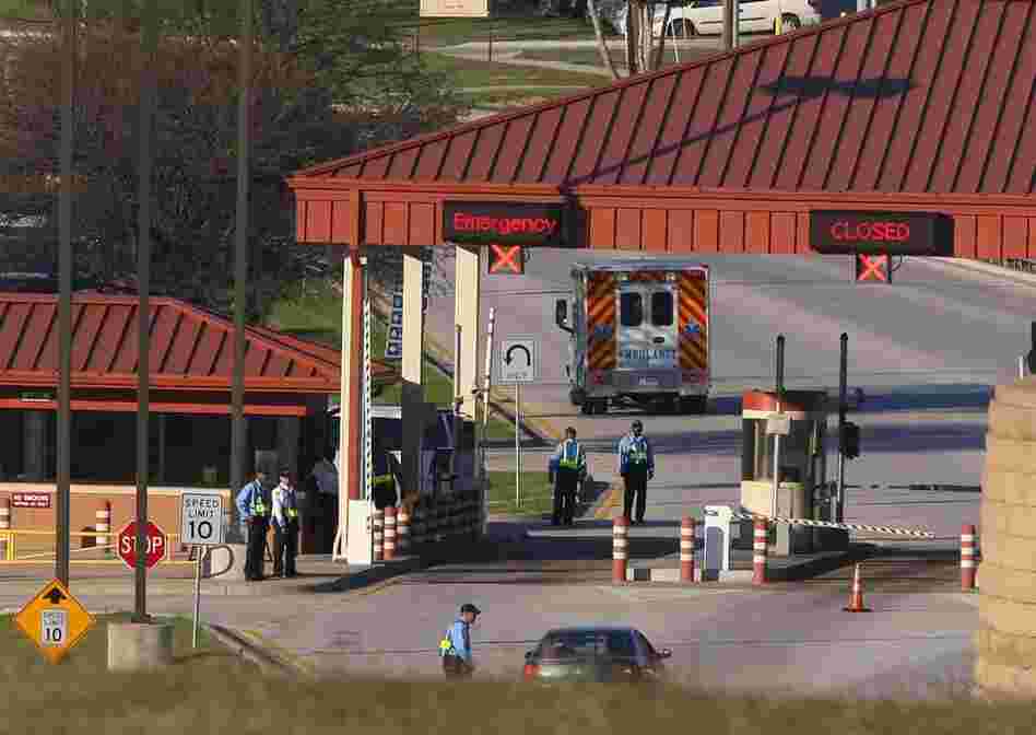 An ambulance passes the main gate at Fort Hood following the shooting. 