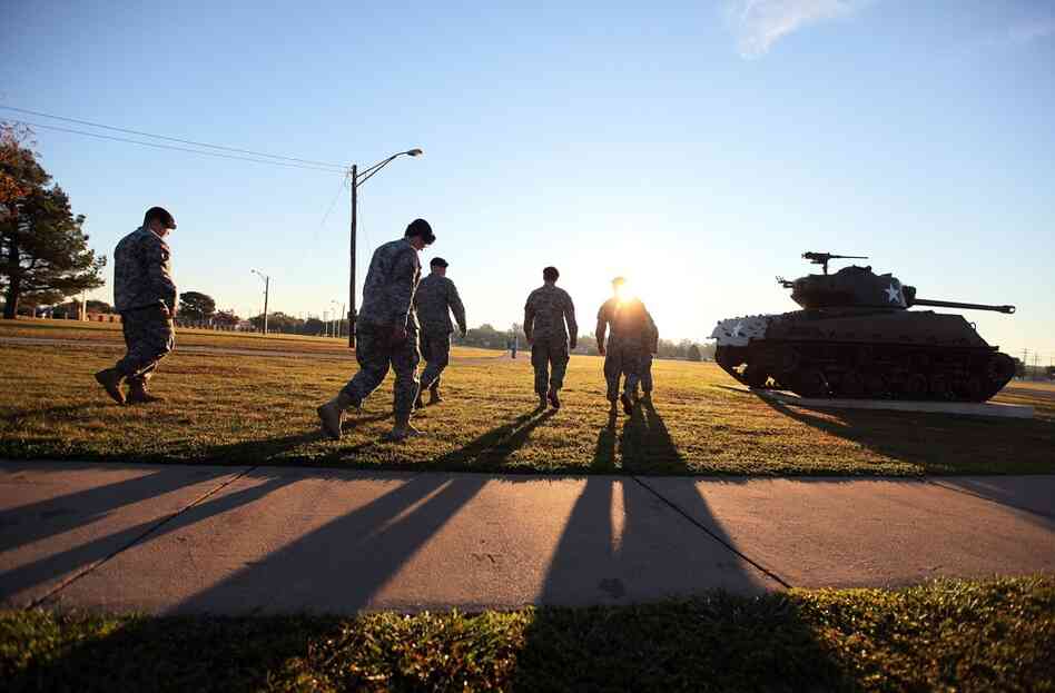 Some of the first responders to the mass shooting at Fort Hood gather to give interviews Friday morning. Thirteen people were killed and 30 were injured in Thursday's shooting. 