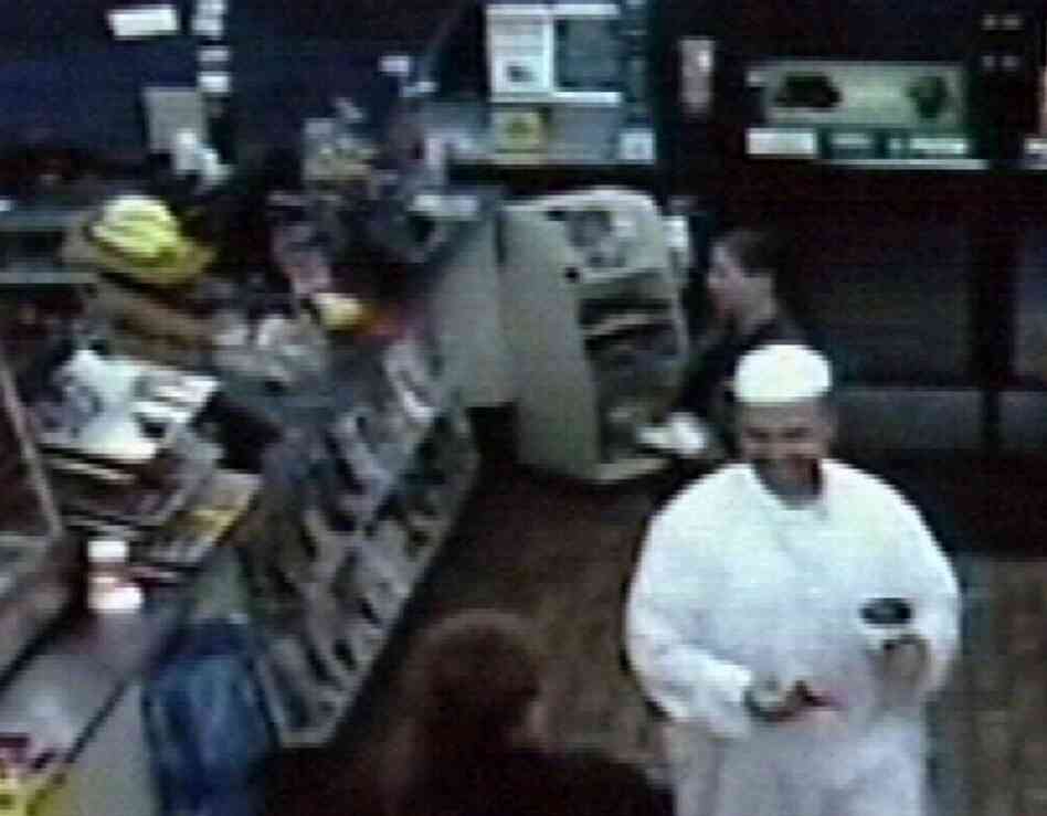 A frame grab from a security video shows suspected shooter Maj. Nidal Malik Hasan in a convenience store in Killeen, Texas, early Thursday morning, before the attack. Hasan, an Army psychiatrist, was unconscious and on a ventilator Friday, contrary to early reports that he had been killed. 