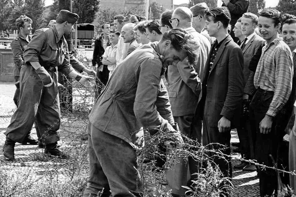 Initial portions of the wall, such as this one shown on Aug. 13, 1961, were constructed not of concrete but of barbed wire. The objective of the wall was to keep East Berliners from defecting to West Berlin.  