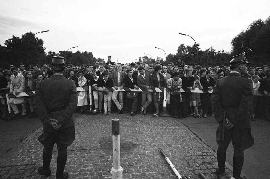 West Berliners protest an East German border blockade two days after construction of the wall began. President Kennedy approached the situation with a passive attitude, saying, "A wall is not nice, but it's a helluva lot better than a war." 