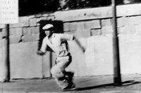 A man attempts to flee East Berlin after climbing over the wall. At least 136 people were killed trying to cross the Berlin Wall between 1961 and 1989.