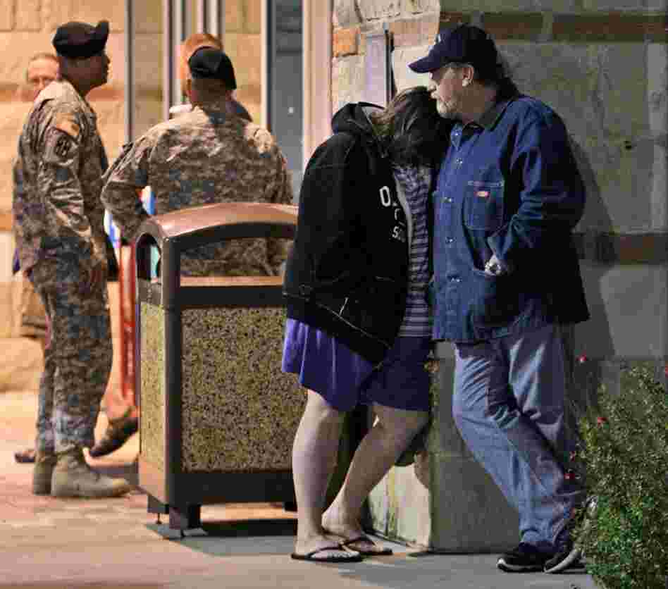 Jamie Casteel and her husband, Scotty, of Duncan, Okla., wait to hear news about their son-in-law Thursday outside the Scott and White Hospital emergency room in Temple, Texas.  