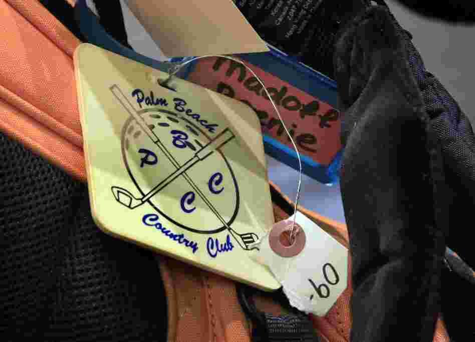 A luggage tag from his golf bag. 