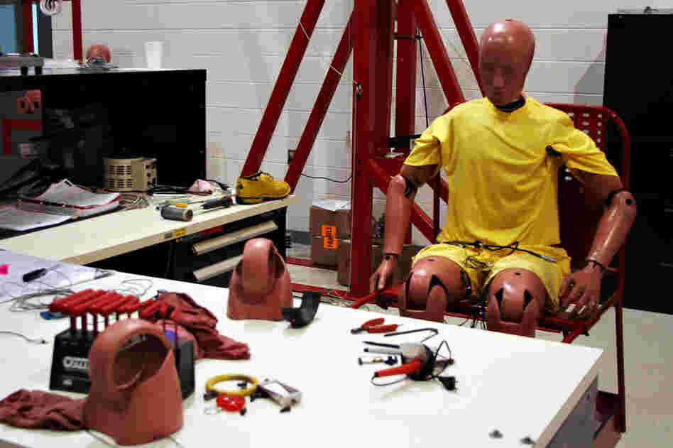 A crash test dummy sits at a workstation inside the Insurance Institute for Highway Safety's Vehicle Research Center in Ruckersville, Va. The IIHS crashes on average two vehicles per week. 