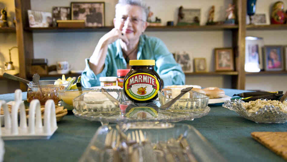 Marmite, a viscous spread made from yeast extract, provokes strong reactions from fans and foes alike. Maggie Hall is a British native and the author of The Mish-Mash Dictionary of Marmite, An Anecdotal A-Z. Here, she poses in her Washington home with an array of Marmite snacks. 