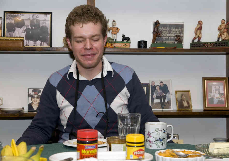 Producer Travis Larchuk grimaces after his first taste of Marmite on toast.