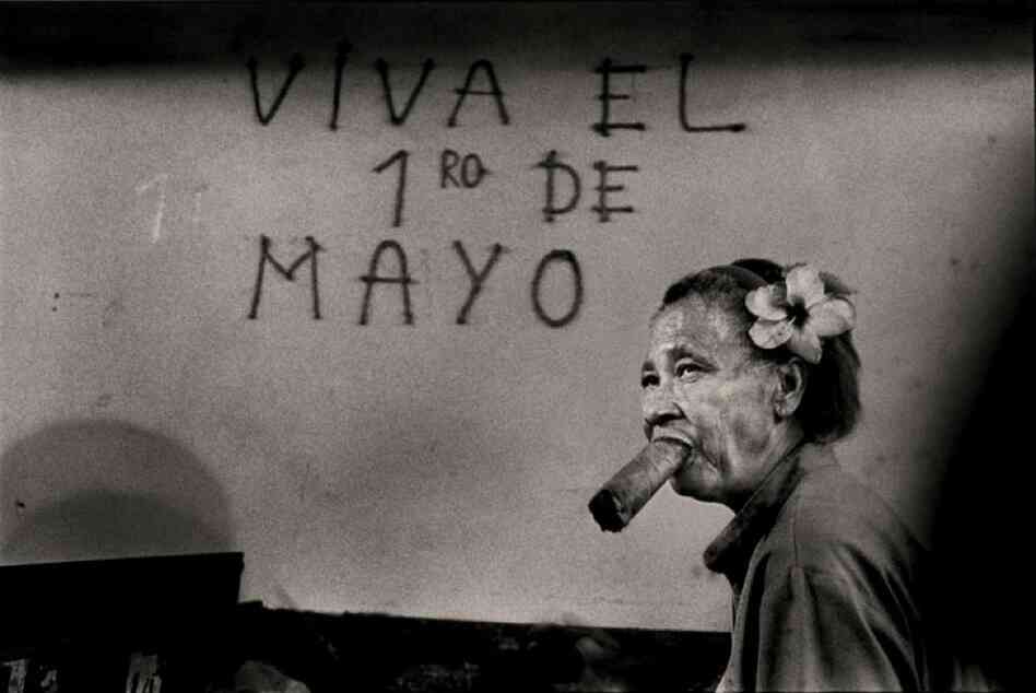 A cigar factory worker begins her shift by rolling a cigar in 1997.