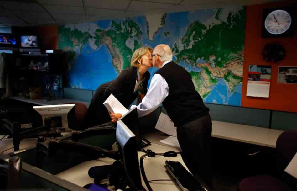 Fellow newscaster Jean Cochran gives Kasell a kiss at 10:55 a.m., moments before he delivered his final newscast.
