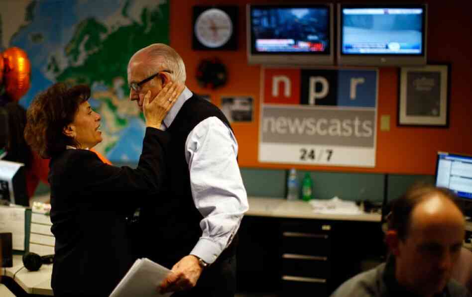 Newscaster Barbara Klein congratulates Kasell after his final news update.