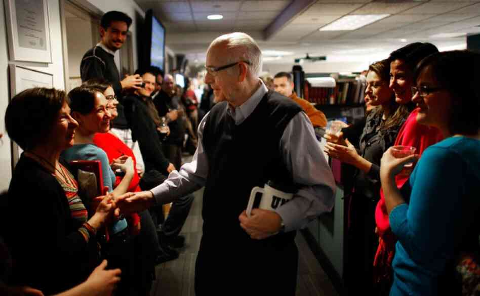 NPR employees line the hallway of the Morning Edition newsroom to cheer for Kasell. He was feted with speeches, champagne and cake following his final 11 a.m. newscast.