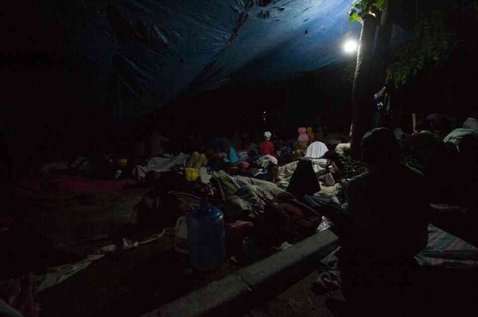 Many Haitians spent a second night on the streets. Here, people gather on a square in Port-au-Prince's Petionville district. 
