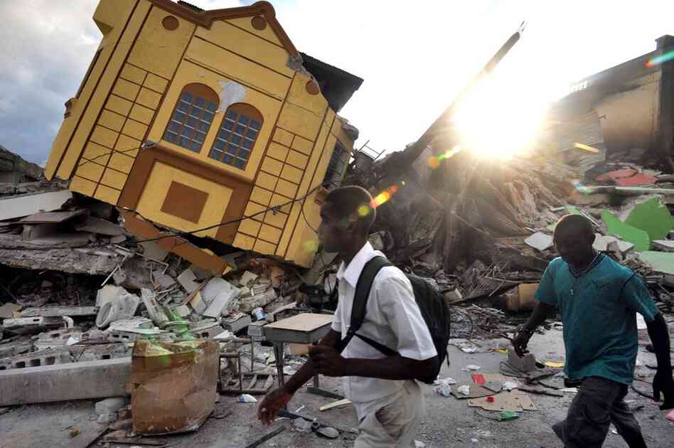 With thousands missing and the death toll climbing, dazed survivors wander amid the ruins of Port-au-Prince two days after the devastating earthquake.  