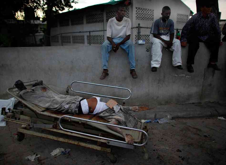 Aid supplies remain scarce and bodies still litter the streets.