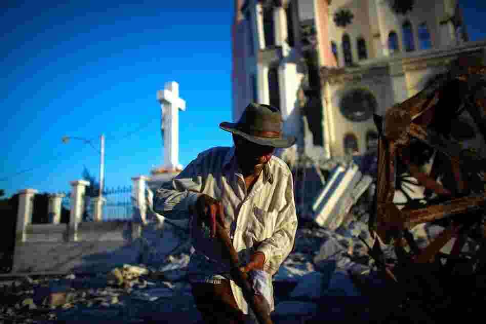A man walks past Our Lady of Assumption Catholic Church in downtown Port-au-Prince.