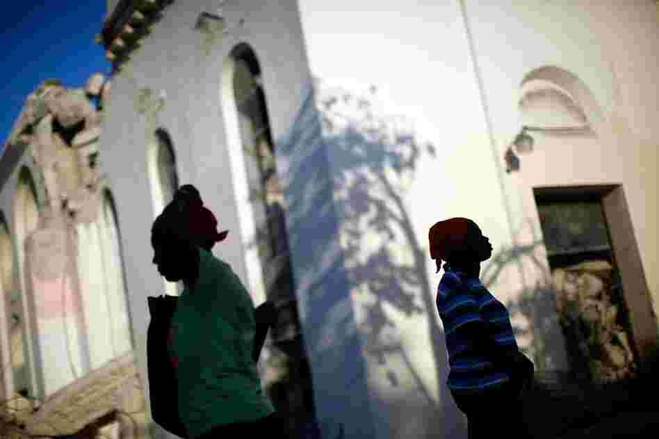 Across Port-au-Prince, people attend Sunday services in the rubble of churches.
