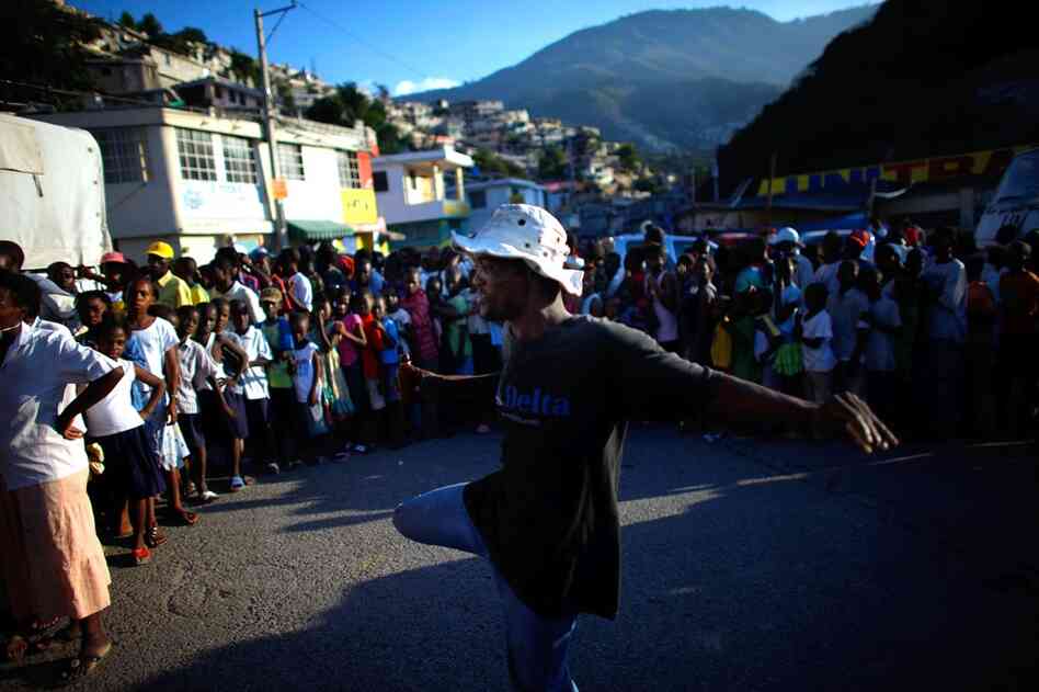 Haitians line up for U.N. food rations. Desperately needed aid is finally arriving in Port-au-Prince, but congestion at the airport is hampering efforts to get supplies to survivors.