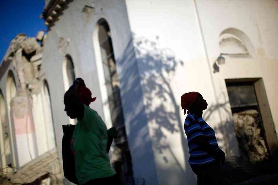 Across Port-au-Prince, people attend Sunday services in the rubble of churches.
