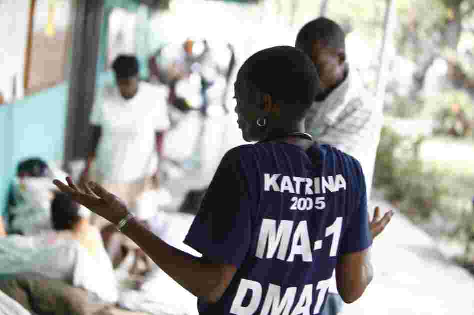 Dr. Thea James from the Massachusetts 1 Disaster Medical Assistance Team speaks with one of many patients seeking treatment on the clinic's second day open.